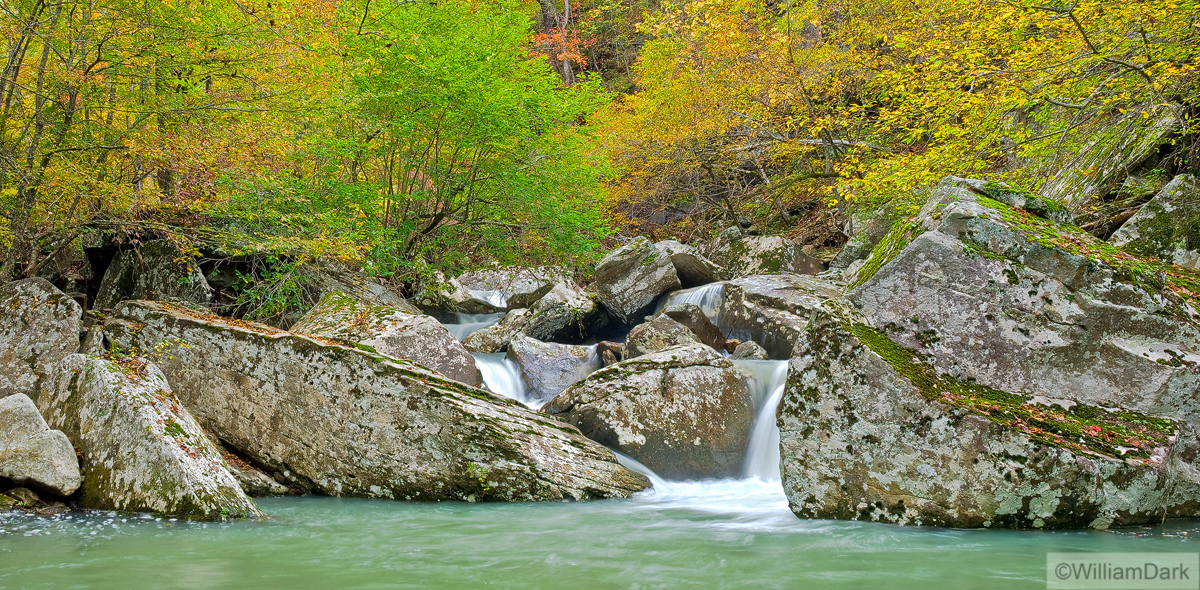 Beautifully-colored cascade of water spills over boulders along one of the tributaries of Richland Creek.  Arkansas Nature Photography...