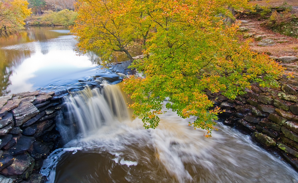 An autumn view of the lake and waterfall above Davies Bridge, Petit Jean State Park, Arkansas.  Arkansas Nature Photography