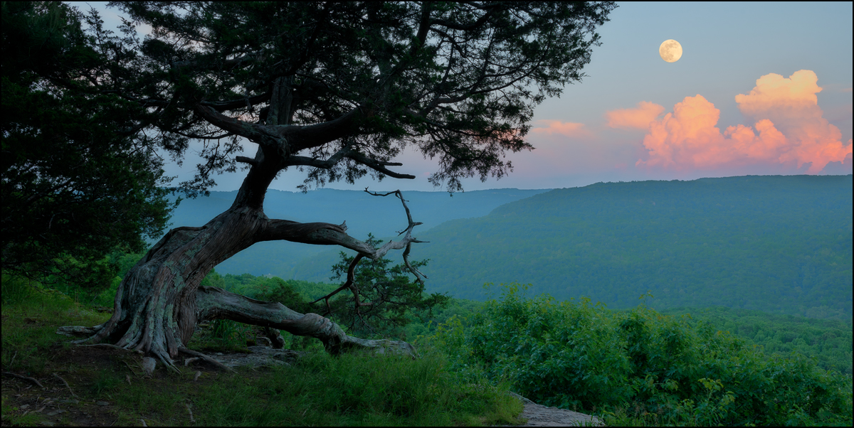 Colorful cloud formations at sunset combined with&nbsp;a beautiful full moon for this image at Hedges pour-off.